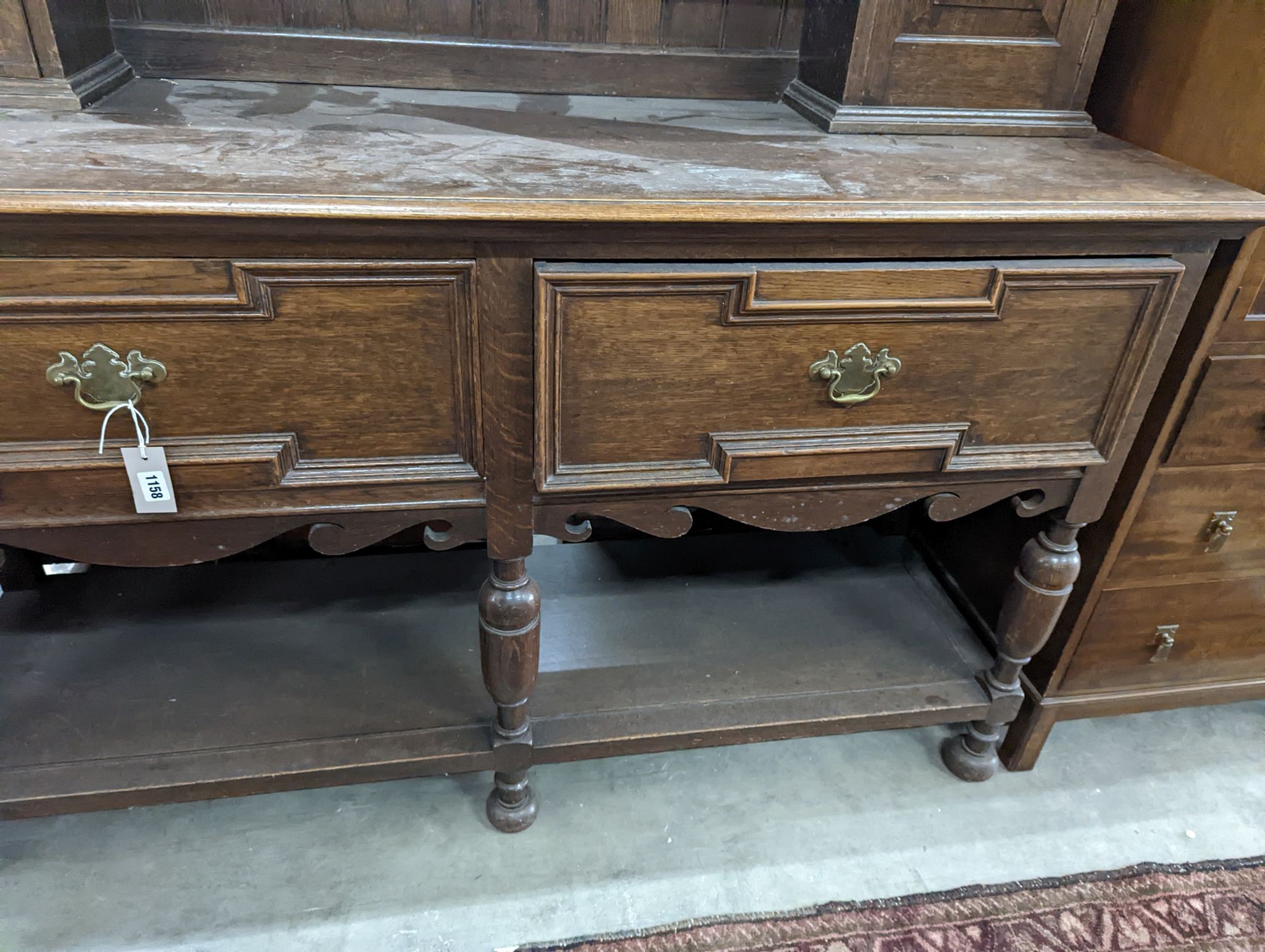 A 1920's oak dresser, length 152cm, depth 49cm, height 188cm